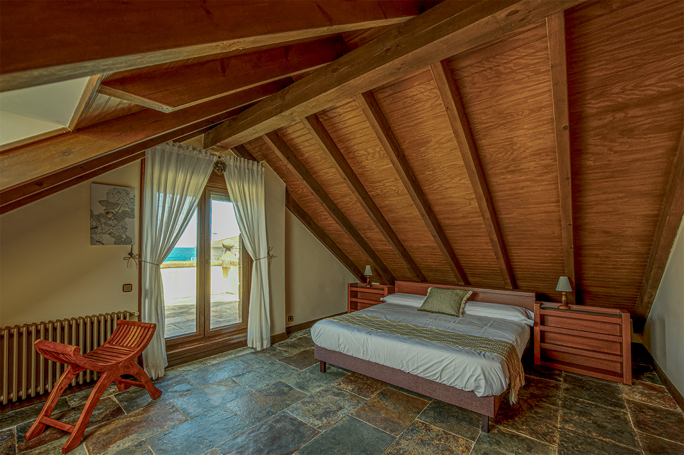 First-floor bedroom with sloping ceilings. Mind your head.